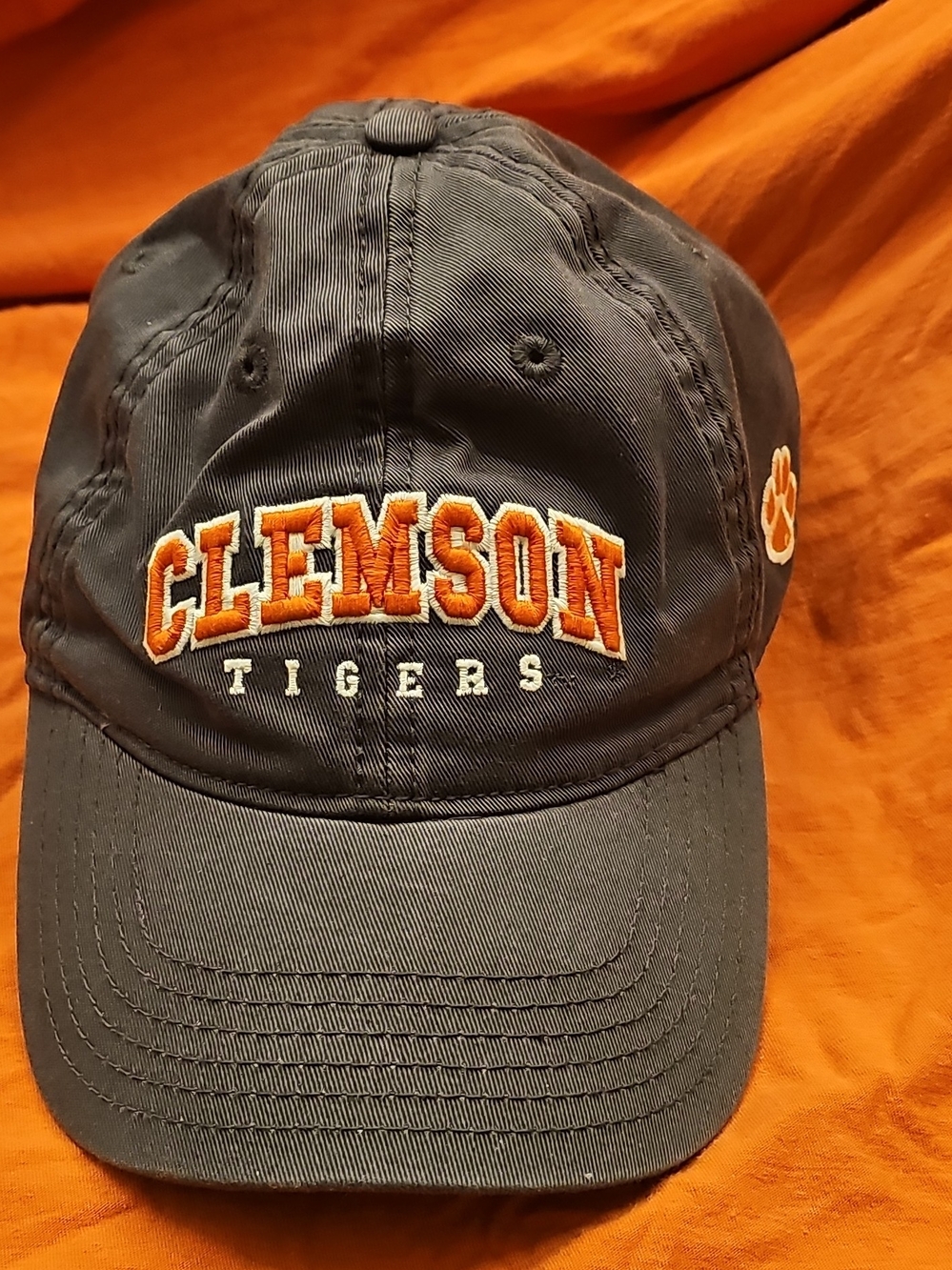 Legay Black Cap with Bright Orange Accent